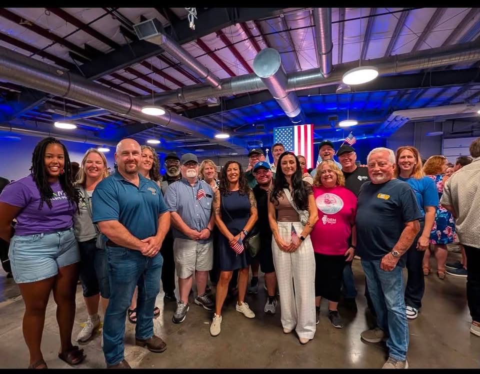 Rachelle Bauerle with supporters at a community rally