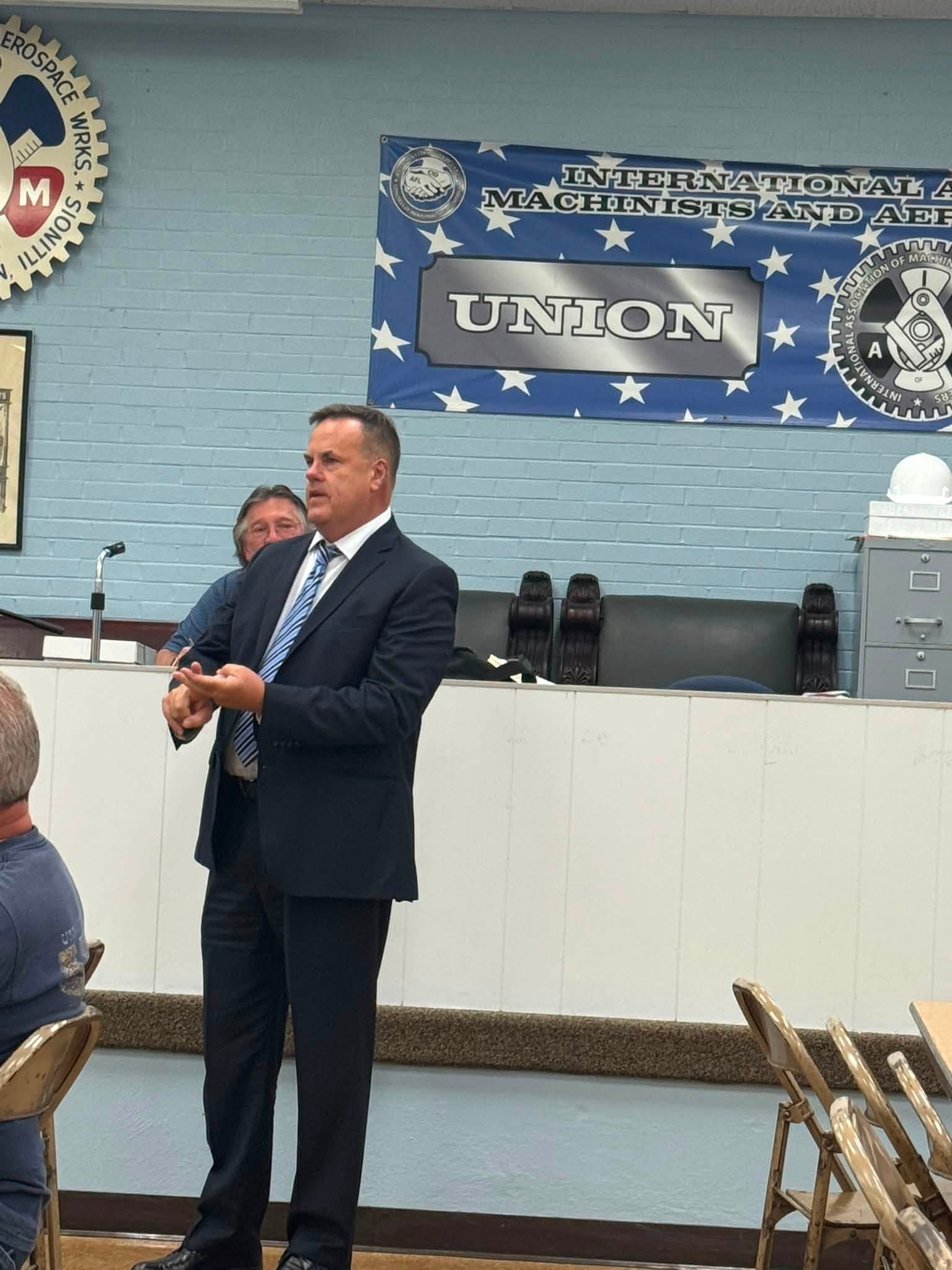Marc Parker speaking to members at a union hall